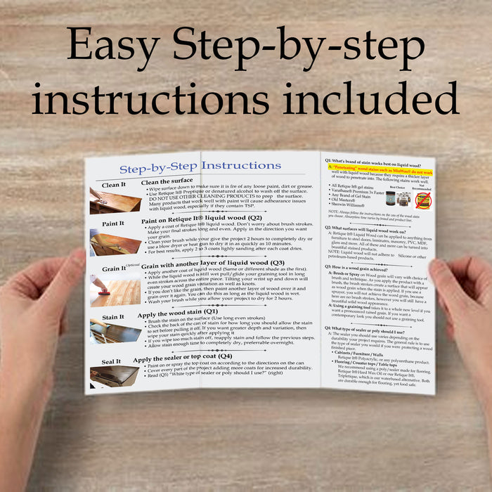 Hands holding the instruction book for Retique It Weathered Finish Kit in Weathered Wood for wood finishing.