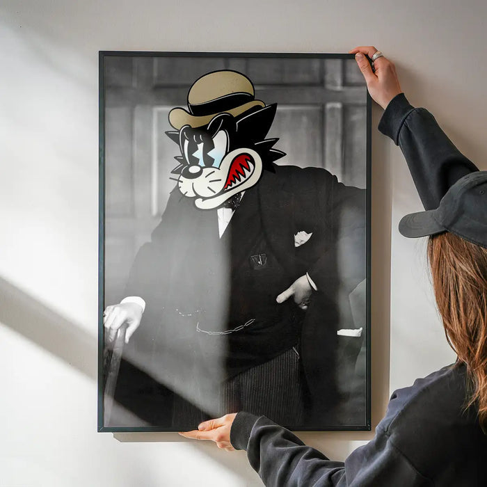 Winston The Cat Portrait Print being hung on a wall in a black frame